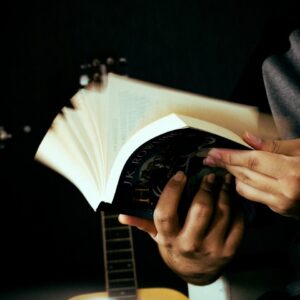 a person holding a guitar